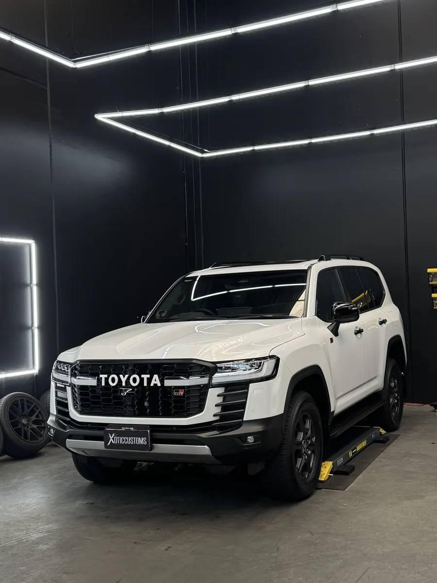 White Toyota LandCruiser GR Sport in the Xotic Customs studio