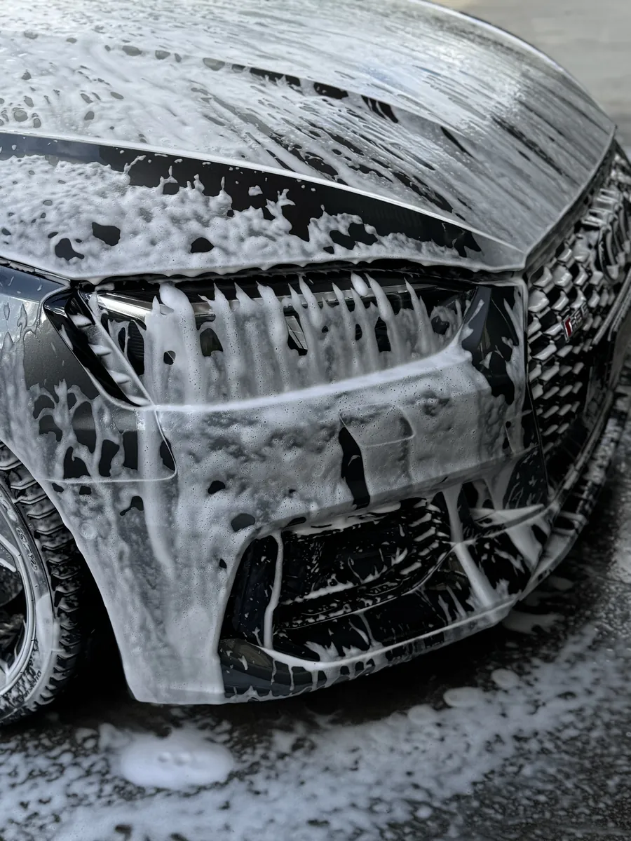 Audi RS 5 covered in snow foam during the pre-wash